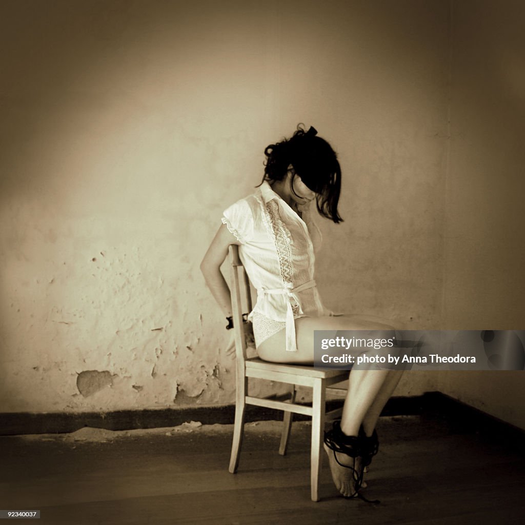 Woman tied to chair