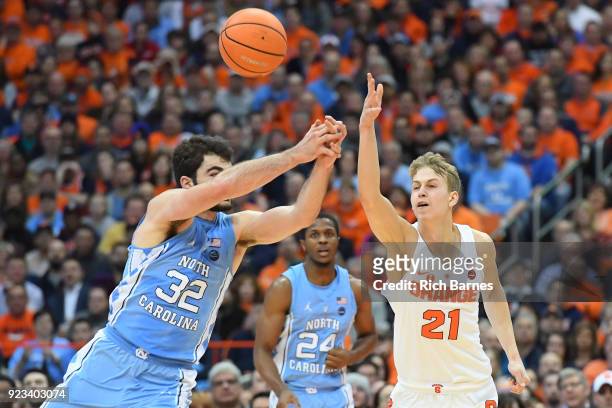 Luke Maye of the North Carolina Tar Heels and Marek Dolezaj of the Syracuse Orange battle for a loose ball during the first half at the Carrier Dome...