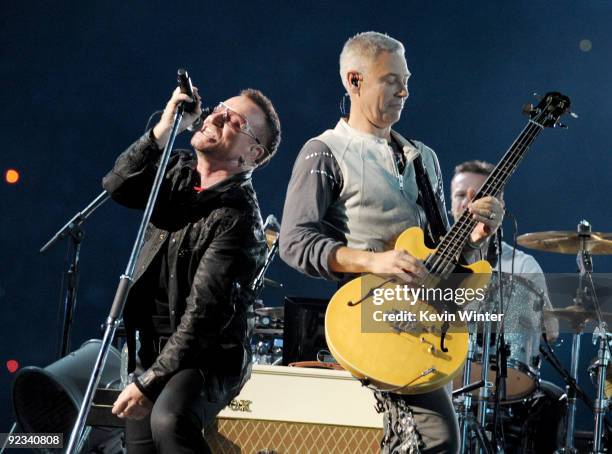 Singer Bono and musician Adam Clayton of U2 perform onstage during their "360 Degrees Tour" at the Rose Bowl on October 25, 2009 in Pasadena,...