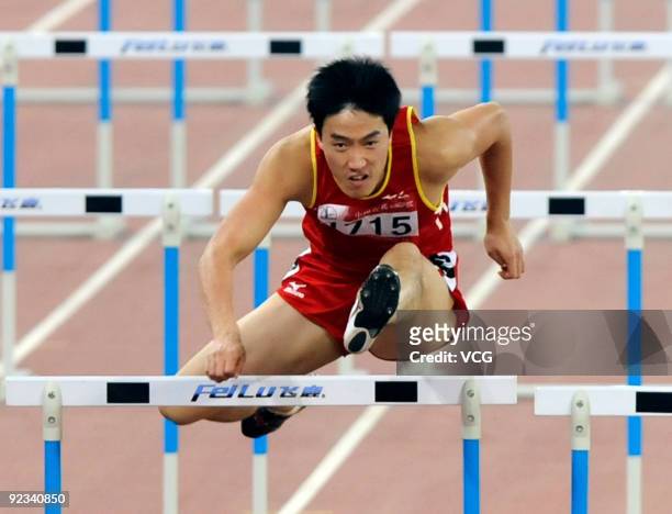 Olympic goldmedalist Liu Xiang from Shanghai competes during the Men's 110m hurdles at the 11th Chinese National Games on October 25, 2009 in Jinan,...
