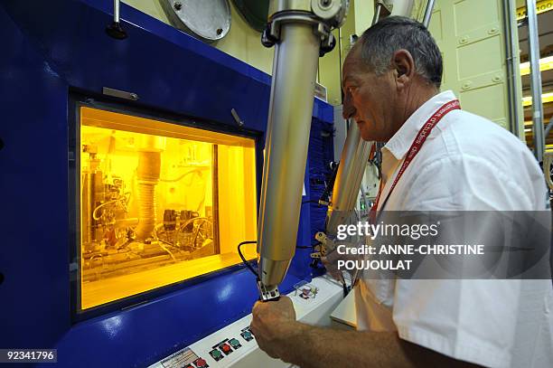 An engineer works on radioactive nuclear fuels at the Laboratory for irradiated fuels study LECA at the Cadarache nuclear research centre of the...