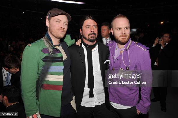 Musicians Dave Grohl of Foo Fighters with Jonny Buckland and Will Champion of Coldplay attend the 51st Annual GRAMMY Awards held at the Staples...