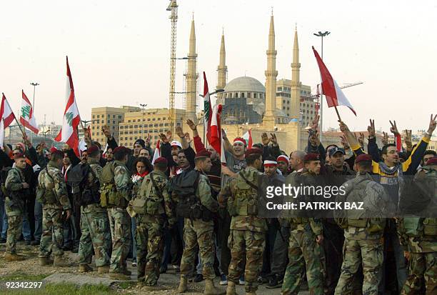 Lebanese troops try to stop anti-Syria protestors from advancing into central Beirut's Martyrs Square 28 February 2005. Thousands of people defied a...