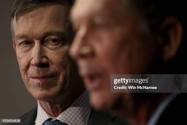 Gov. John Hickenlooper listens as Gov. John Kasich speaks during a press conference February 23, 2018 in Washington, DC. The three governors unveiled...