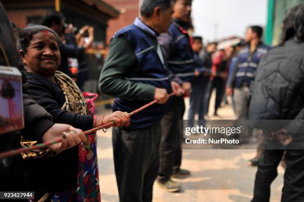 Members of Manandhar Guthi ready to erect ceremonial Bamboo Log known as &quot;Chir&quot; along with the vibrant cloth strips, which representing...