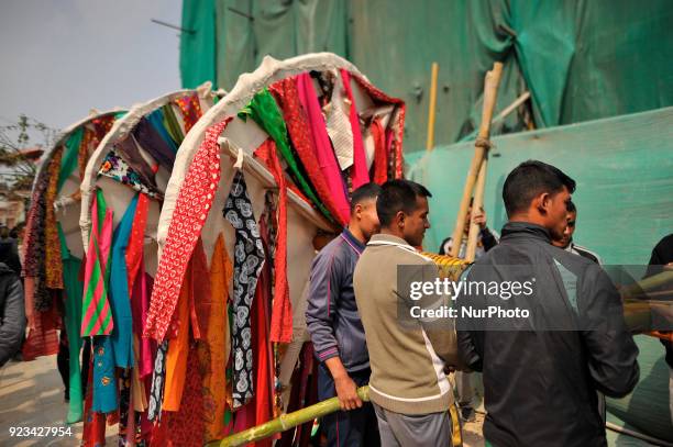 Members of Manandhar Guthi community arranging ceremonial Bamboo Log know as &quot;Chir&quot; along with the vibrant cloth strips, which representing...