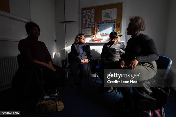 Shadow Home Secretary Diane Abbott listens as a group of former detainees of the Yarl's Wood Immigration Detention Centre talk about their...