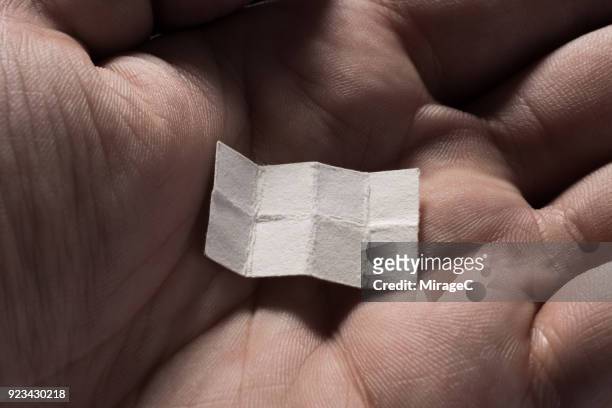 blank unfold paper slip in hand palm - tiny hands stock pictures, royalty-free photos & images