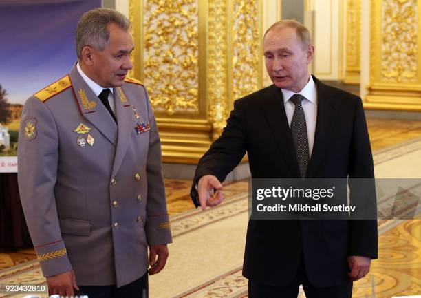 Russian President Vladimir Putin and Defence Minister Sergei Shoigu are seen during an awarding ceremony marking the Defender of the Fatherland's Day...