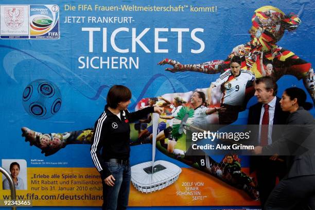 Ariane Hingst of the German national football team, DFB secretary general Wolfgang Niersbach and Steffi Jones, president of the FIFA OK Germany 2011...