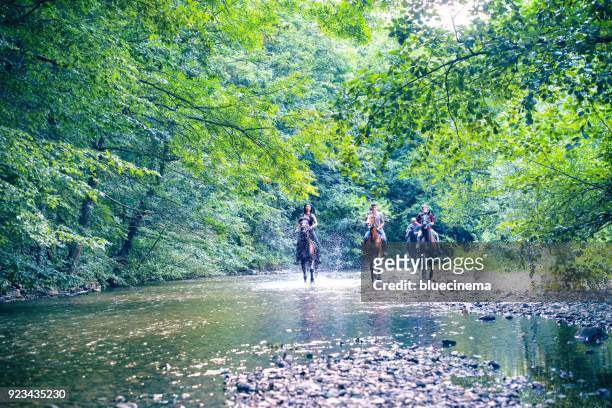 people riding horseback together - racehorse owner stock pictures, royalty-free photos & images