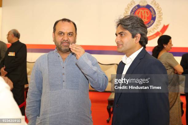 Mahesh Giri with journalist Sudhir Chaudhary during the reception of 71st Raising Day of Delhi Police on February 20, 2018 in New Delhi, India.