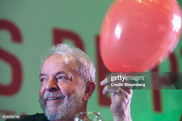 Luiz Inacio Lula da Silva, Brazil's former president, holds a balloon during the 38th Anniversary celebration of the Workers' Party event in Sao...