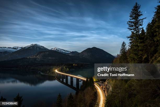 fullmoon night at lake sylvensteinspeicher - light trail nature stock pictures, royalty-free photos & images