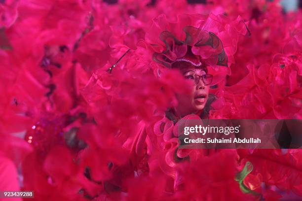 Performers dance down the street during the Cultural Fantasy, Chingay Parade on February 23, 2018 in Singapore. The Chingay Parade started in 1973...