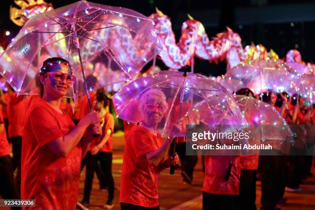 Performers dance down the street during the Cultural Fantasy, Chingay Parade on February 23, 2018 in Singapore. The Chingay Parade started in 1973...