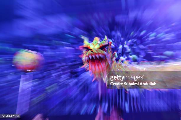 The dragon dance performers dance down the street during the Cultural Fantasy, Chingay Parade on February 23, 2018 in Singapore. The Chingay Parade...