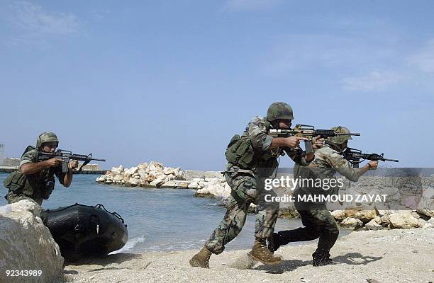 Lebanese Army troops take part in a joint amphibious drill with soldiers from the Italian contingent serving with the United Nations Interim Force in...