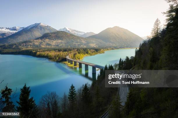 sunset at lake sylvensteinspeicher - german alpine road stock pictures, royalty-free photos & images