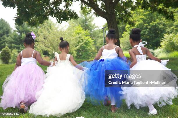 4 african american little girls holding hands back view - morristown fotografías e imágenes de stock