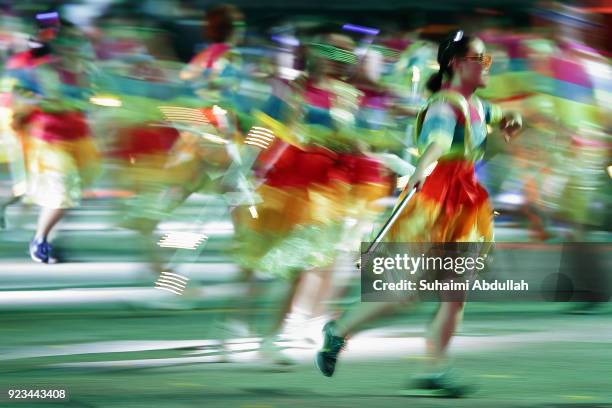 Performers dance down the street during the Cultural Fantasy, Chingay Parade on February 23, 2018 in Singapore. The Chingay Parade started in 1973...