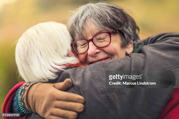 comforting embrace - cuddling stock pictures, royalty-free photos & images
