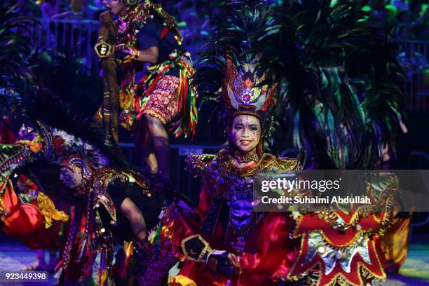 Indonesian performers dance down the street during the Cultural Fantasy, Chingay Parade on February 23, 2018 in Singapore. The Chingay Parade started...