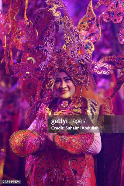 Indonesian performers dance down the street during the Cultural Fantasy, Chingay Parade on February 23, 2018 in Singapore. The Chingay Parade started...