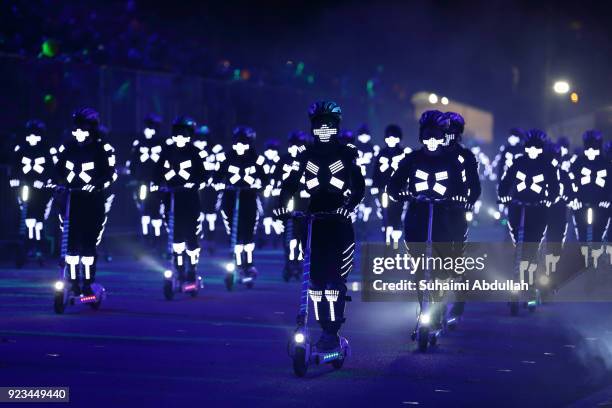 Performers on skate scooters ride down the street during the Cultural Fantasy, Chingay Parade on February 23, 2018 in Singapore. The Chingay Parade...