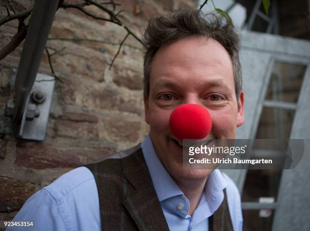 Eckaert von Hirschhausen, german moderator, doctor, magician, cabaret artist, comedian and writer, with an red clown nose.