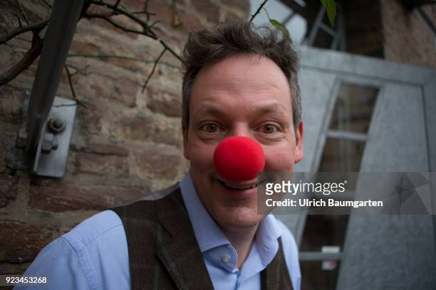 Eckaert von Hirschhausen, german moderator, doctor, magician, cabaret artist, comedian and writer, with an red clown nose.