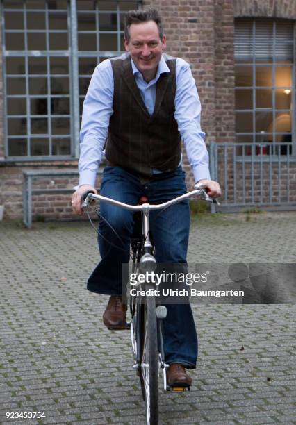 Eckaert von Hirschhausen, german moderator, doctor, magician, cabaret artist, comedian and writer. Hirschhausen on a bicycle on the the way to an...