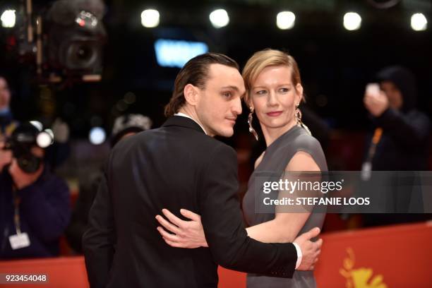 German actress Sandra Hueller and German actor Franz Rogowski pose on the red carpet before the premiere of the film "In the aisles" presented in...