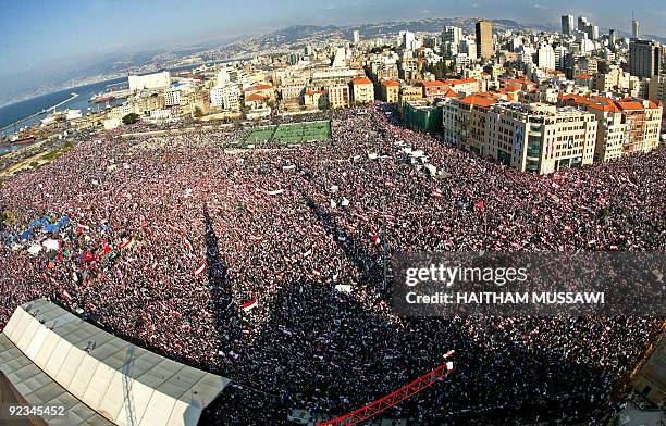 The shadow of Mohamad al-Amin mosque where late Prime Minister Rafiq Hariri is burried, is cast on hundreds of thousands of Lebanese demonstrators...