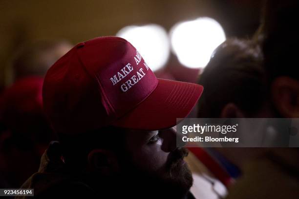 An attendee wears a "Make America Great Again" hat as U.S. President Donald Trump, not pictured, speaks at the Conservative Political Action...