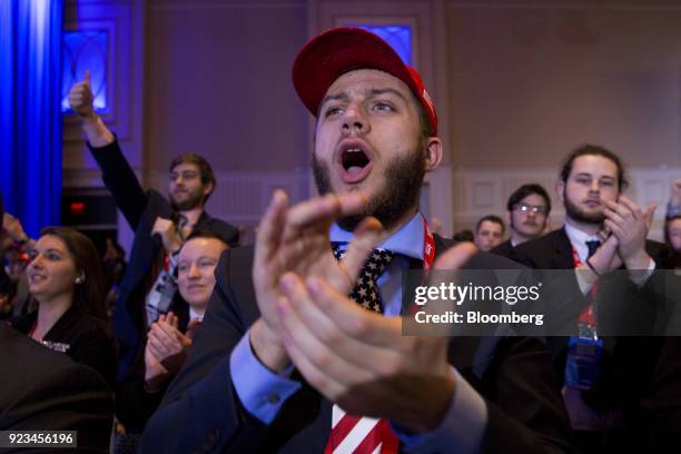 Attendees cheer as U.S. President Donald Trump, not pictured, speaks at the Conservative Political Action Conference in National Harbor, Maryland,...
