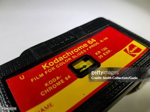 Close-up of Kodak 126 film cartridge containing Kodachrome 64 film, a classic color reversal slide film, used in 1960s and 1970s era Instamatic...