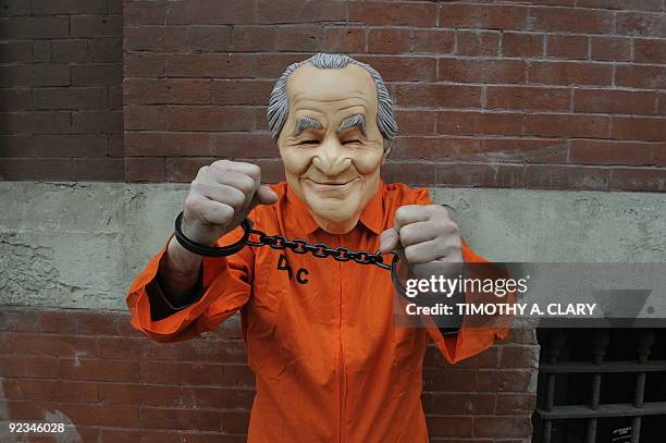 Employee of Spirit Halloween shows off this years hottest Halloween outfit, the rubber Bernie Madoff mask outside their New York store October 16,...