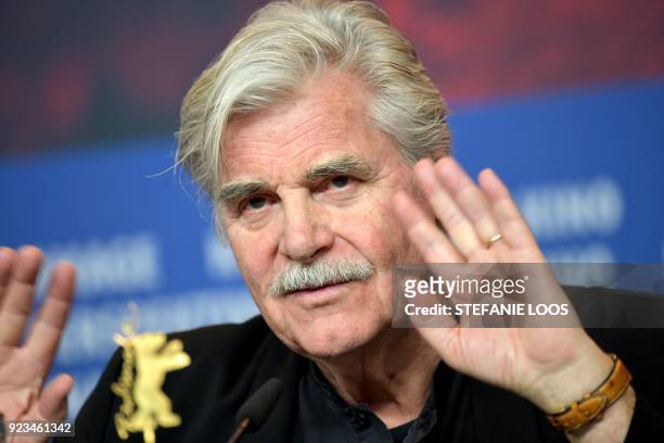 Austrian actor Peter Simonischek gestures during a press conference for the film "The interpreter" presented in the "Berlinale special" category...