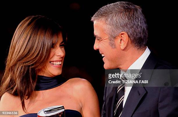 Actor George Clooney and girlfriend Italian model and actress Elisabetta Canalis arrive for the screening of "Up in the Air" on October 17, 2009 at...