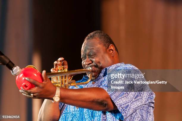 American Blues musician James 'Boogaloo' Bolden plays trumpet as he leads the BB King Orchestra on Grant Park's Petrillo Music Shell stage during the...
