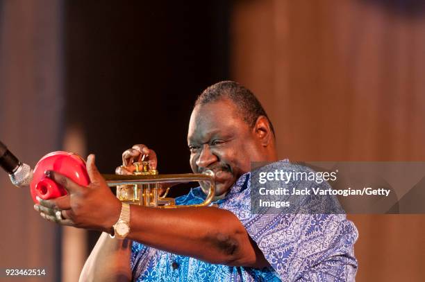 American Blues musician James 'Boogaloo' Bolden plays trumpet as he leads the BB King Orchestra on Grant Park's Petrillo Music Shell stage during the...