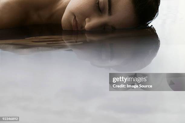 young woman in water - face symmetry stock pictures, royalty-free photos & images