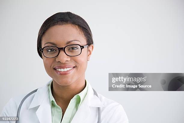 portrait of a doctor - female doctor on white stock pictures, royalty-free photos & images