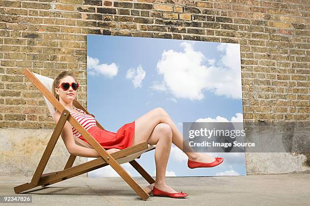 young woman in deckchair - heart chair design stock pictures, royalty-free photos & images