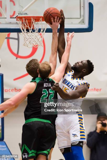 Cal State Bakersfield Roadrunners center Fallou Ndoye goes for a layup against Utah Valley Wolverines forward Isaac Neilson during the game between...