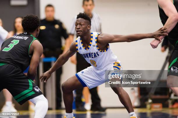 Cal State Bakersfield Roadrunners guard Jarkel Joiner defends Utah Valley Wolverines guard Brandon Randolph during the game between the Utah Valley...