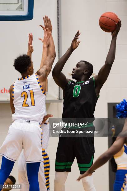 Utah Valley Wolverines center Akolda Manyang takes a shot over the top of Cal State Bakersfield Roadrunners forward Greg Lee during the game between...