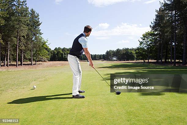 male golfer on the fairway - golfer stock pictures, royalty-free photos & images