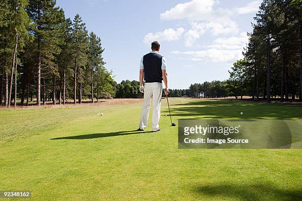 male golfer on the fairway - golfer stock pictures, royalty-free photos & images